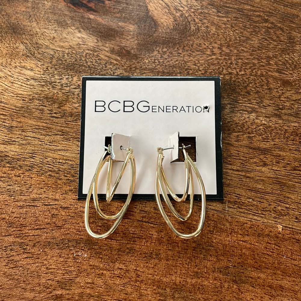 Gold hooped earrings never been worn BCBG